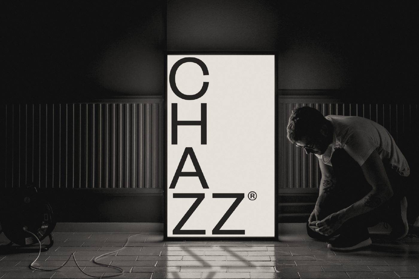 Chazz lightbox sign being installed in the studio