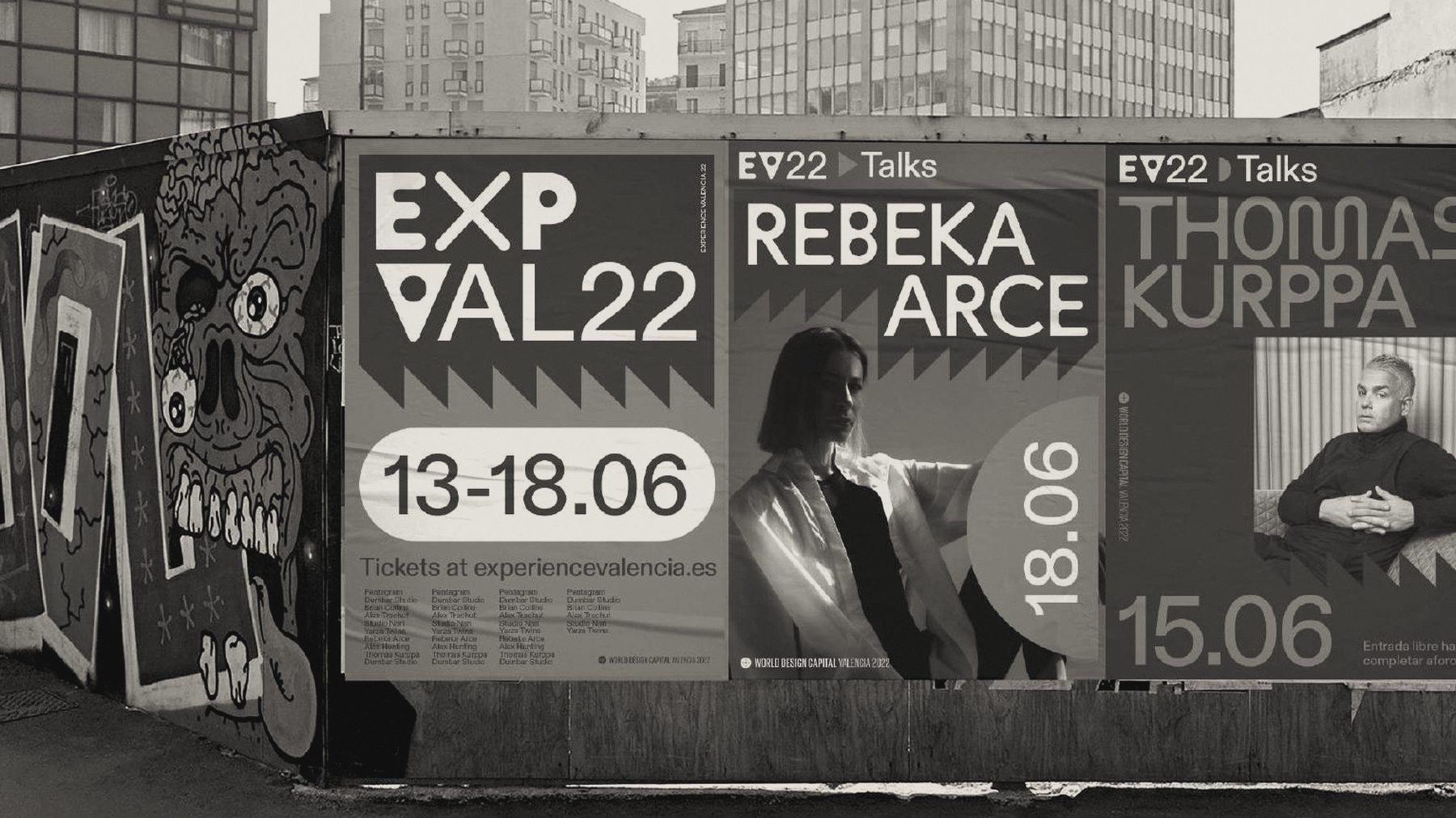 Experience Valencia 22 posters on a street wall in València